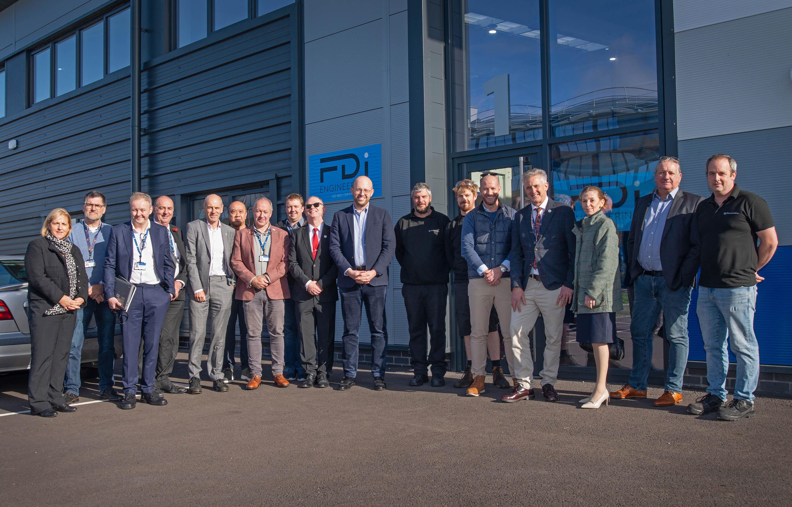 Group shot of attendees at launch event outside DIP building