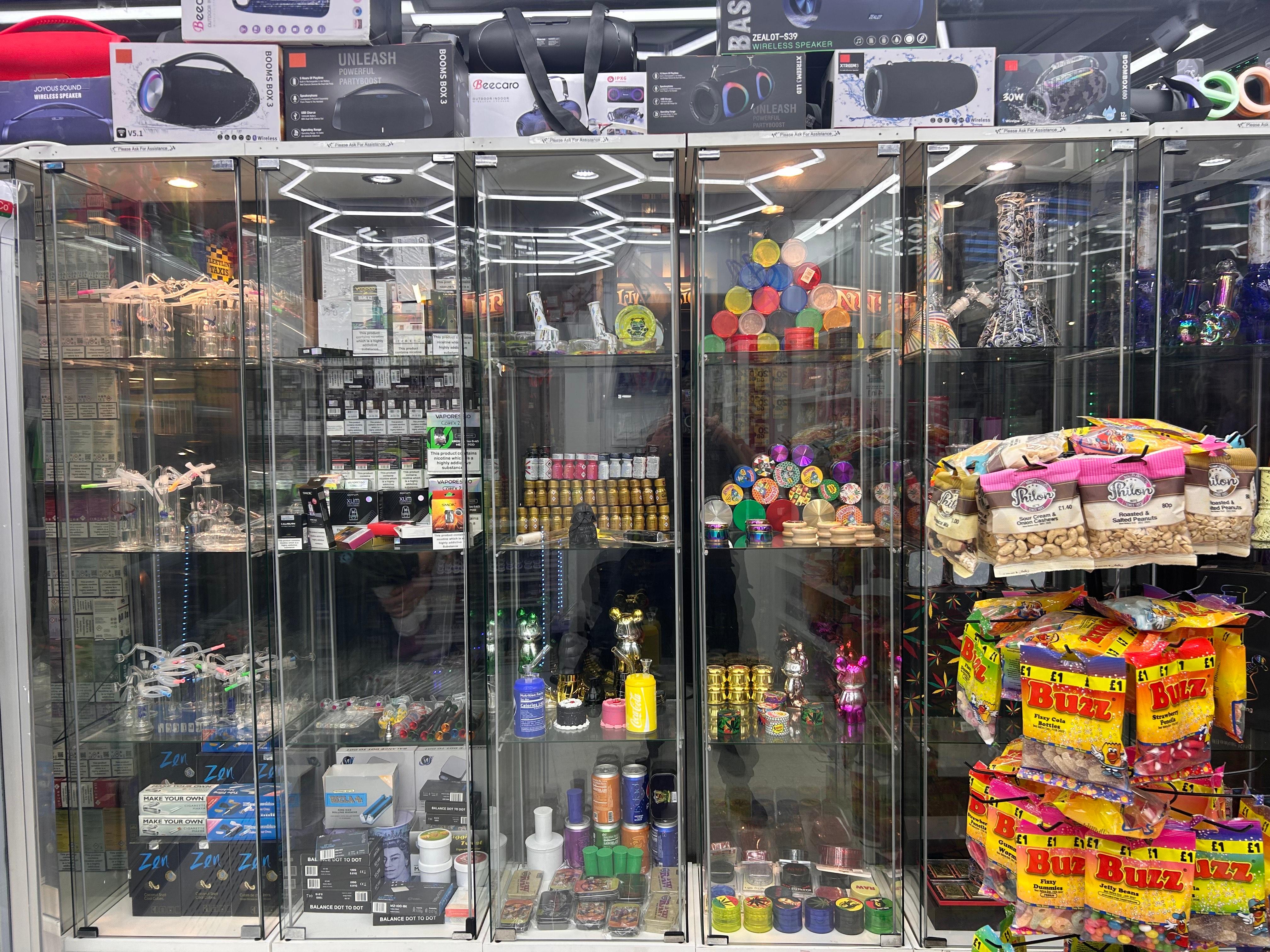 A window with lots of colourful smoking products