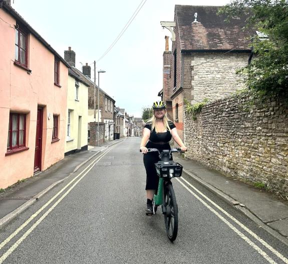 A person riding a Beryl bike in Dorchester