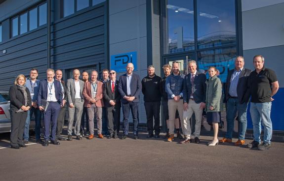 Group shot of attendees at launch event outside DIP building