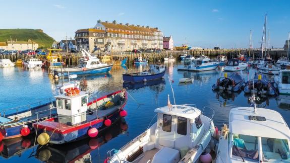A photo of small boats on a harbour