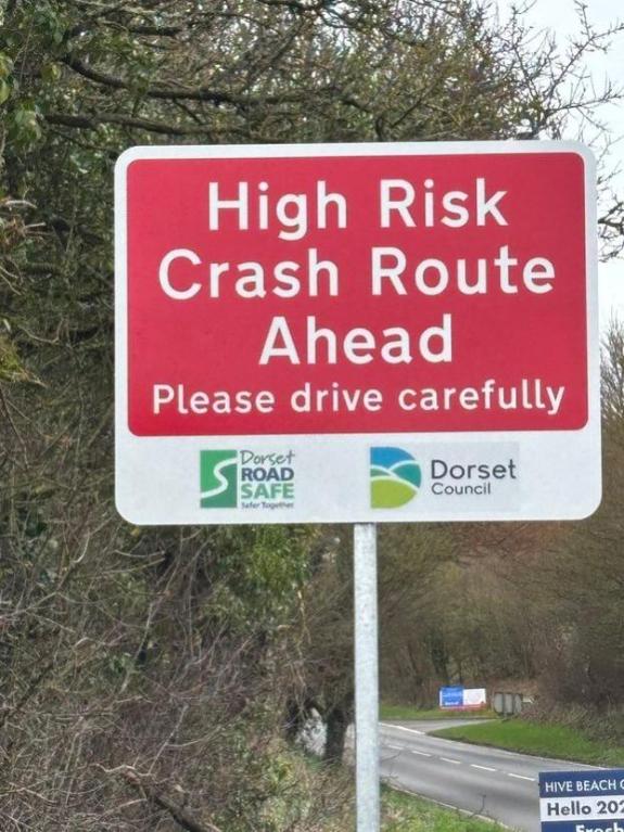 Sign saying High Risk Crash Route Ahead